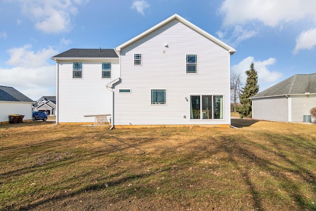 back of house with a yard