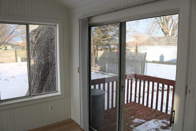 unfurnished sunroom featuring lofted ceiling