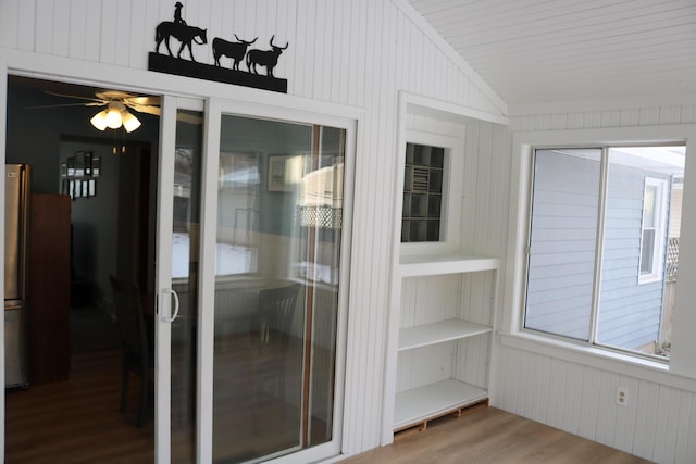 unfurnished sunroom with vaulted ceiling