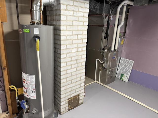 utility room featuring water heater and heating unit