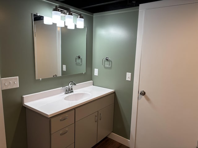 bathroom featuring baseboards and vanity