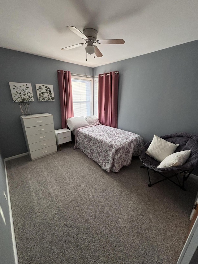 bedroom featuring a ceiling fan and carpet