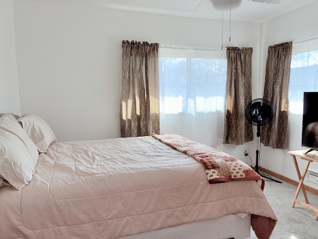 carpeted bedroom with baseboards