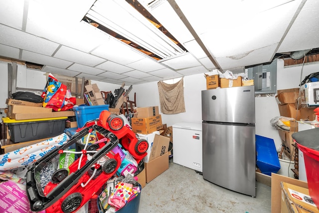 basement with fridge and freestanding refrigerator