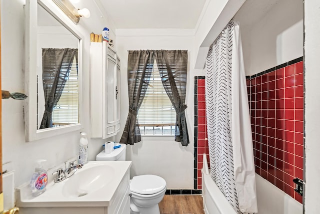 bathroom featuring shower / bath combo with shower curtain, toilet, vanity, and wood finished floors