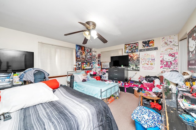 bedroom featuring ceiling fan and carpet