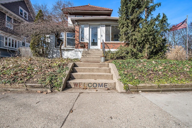 view of front of house featuring brick siding