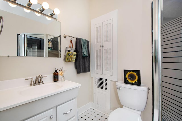 bathroom with toilet and vanity