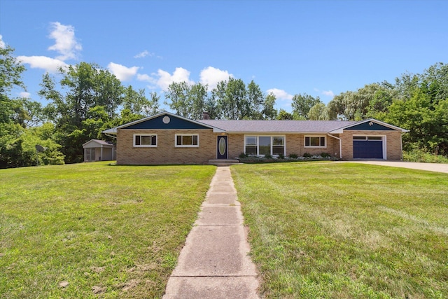 single story home featuring a chimney, concrete driveway, a front lawn, a garage, and brick siding