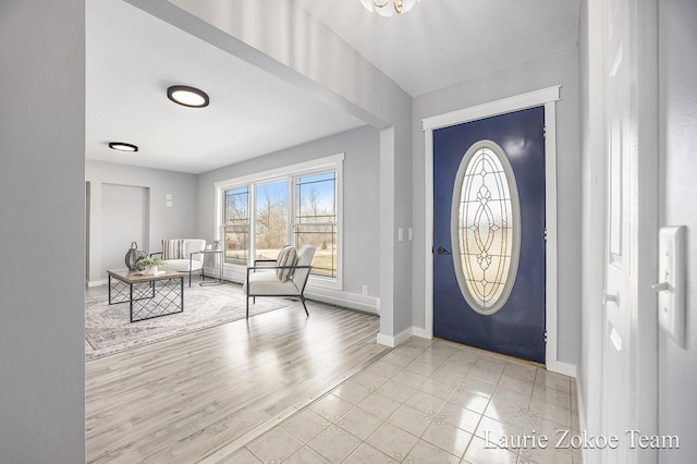 entryway featuring wood finished floors and baseboards