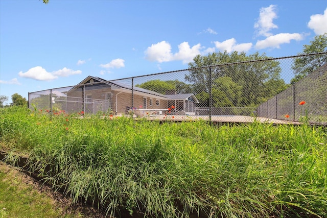 view of property's community with fence