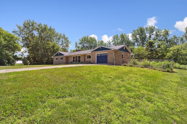 ranch-style home featuring brick siding, fence, concrete driveway, a front yard, and a garage