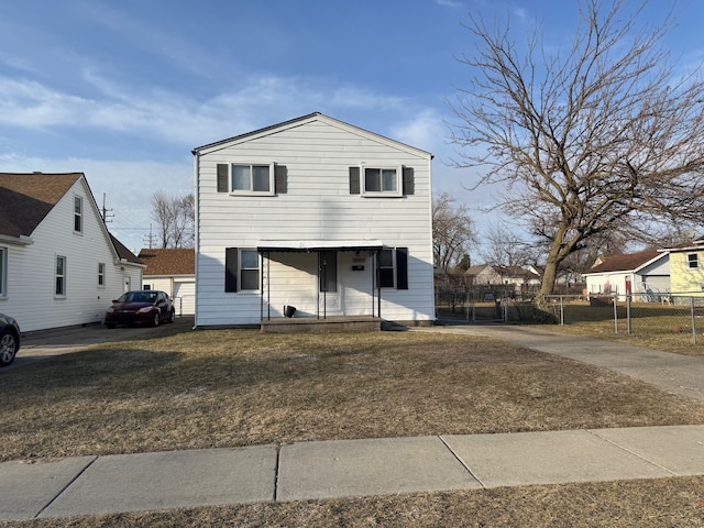 view of front of home featuring a front yard and fence