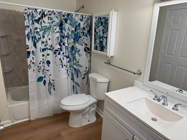 full bath with vanity, shower / bath combination with curtain, toilet, and wood finished floors