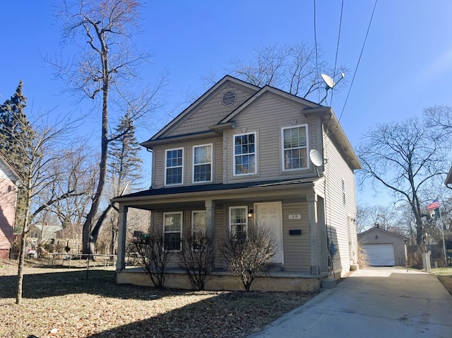 traditional home featuring a garage, a porch, an outdoor structure, and driveway