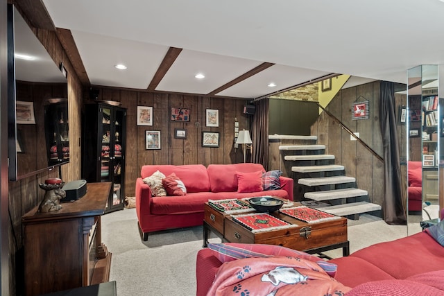 carpeted living room with recessed lighting, stairway, wooden walls, and beamed ceiling