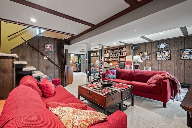 living room with stairway, wooden walls, carpet, beam ceiling, and recessed lighting