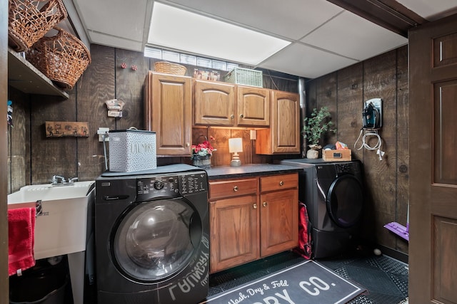 laundry room featuring a sink, cabinet space, and washing machine and clothes dryer