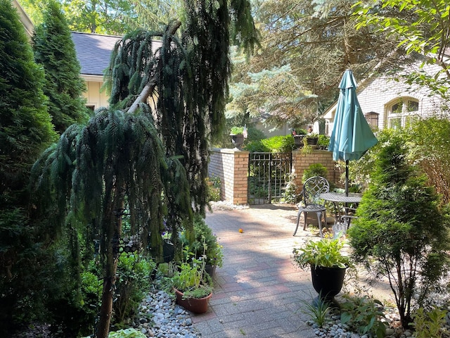 exterior space featuring fence and a gate