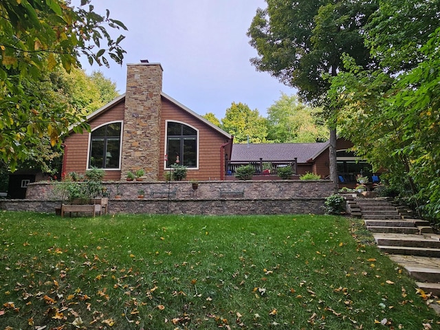 view of property exterior featuring a lawn and a chimney