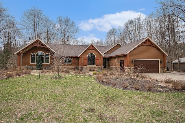 chalet / cabin with driveway, stone siding, a front lawn, a garage, and a shingled roof