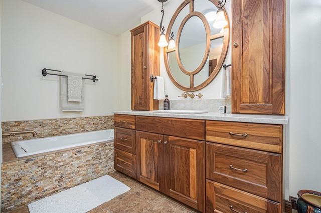 bathroom with a bath and vanity