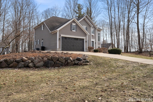 view of side of property with driveway