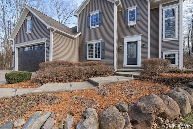 view of front of home with a garage and driveway