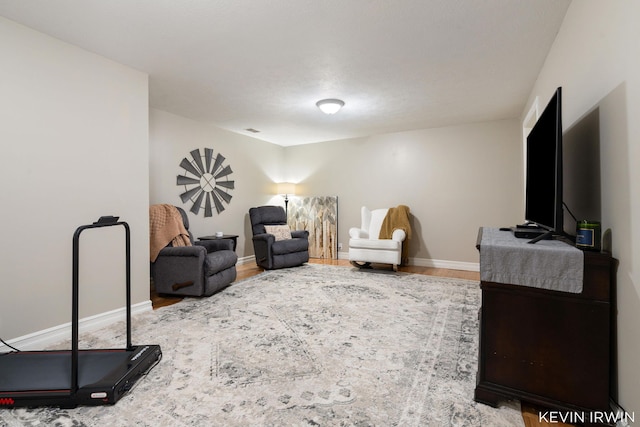 interior space featuring wood finished floors and baseboards