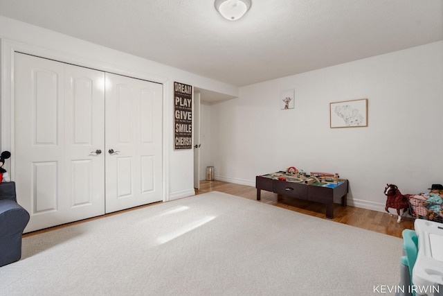 game room with wood finished floors and baseboards