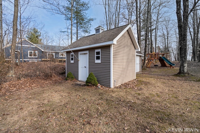 view of outbuilding featuring an outbuilding and a playground