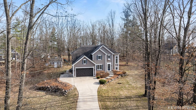 view of front of house with a front lawn and driveway