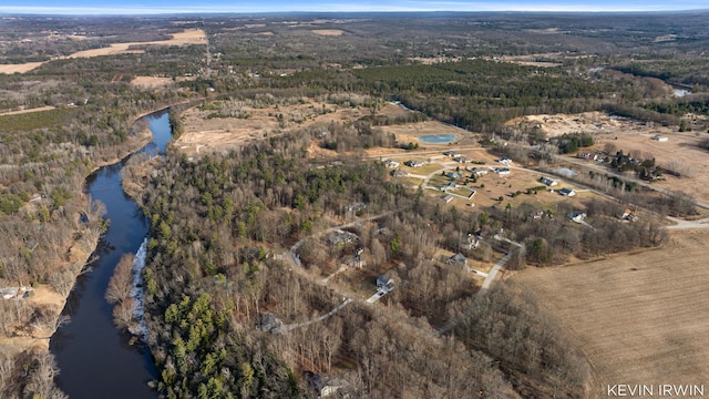 bird's eye view featuring a view of trees and a water view