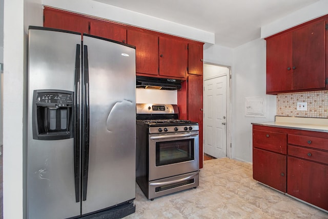 kitchen featuring under cabinet range hood, stainless steel appliances, decorative backsplash, and light countertops