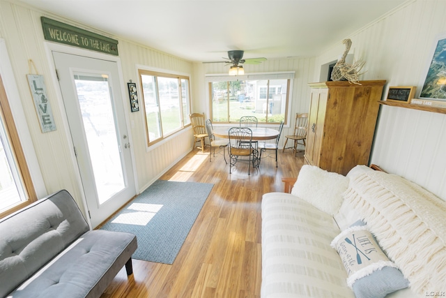 living room featuring wood finished floors and ceiling fan