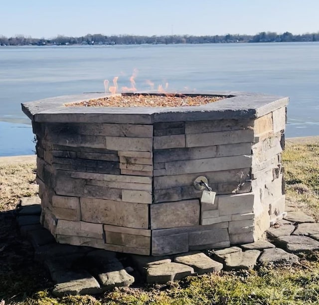 exterior details with an outdoor fire pit