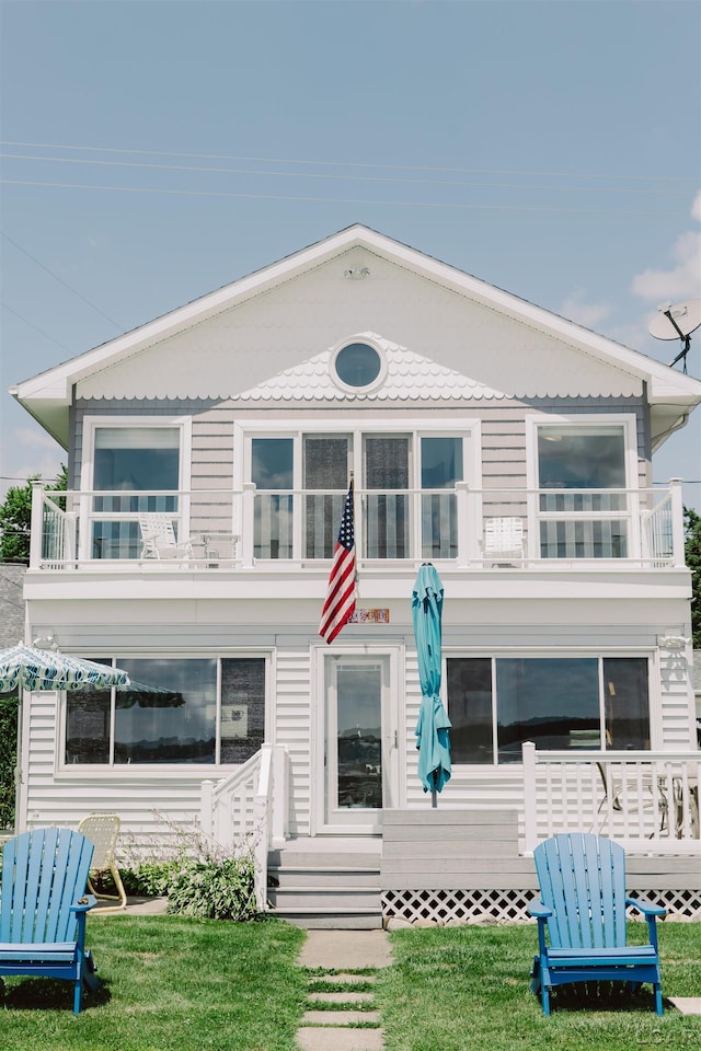 view of front of house with a balcony