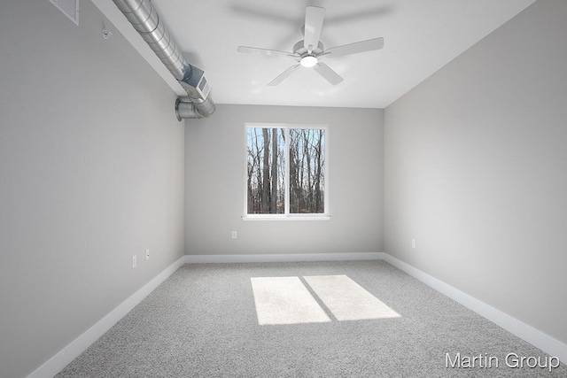 carpeted empty room with baseboards and ceiling fan