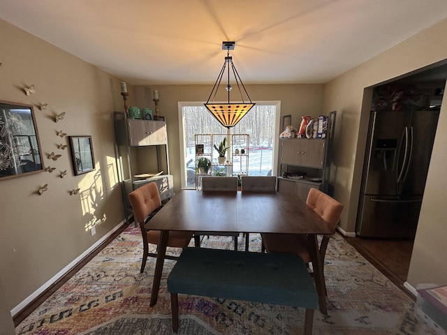 dining room featuring baseboards