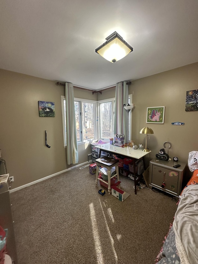 home office with baseboards and carpet floors