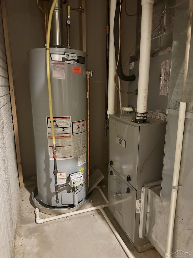 utility room featuring water heater