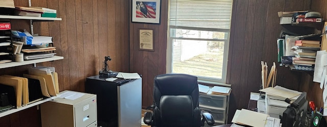 office space featuring wooden walls