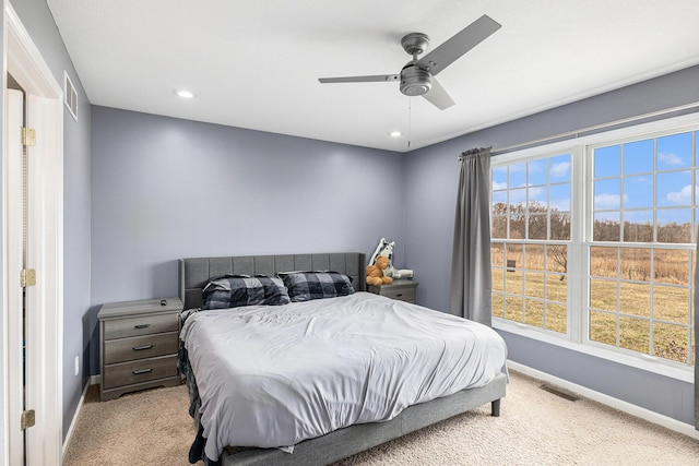 bedroom featuring recessed lighting, visible vents, light colored carpet, and baseboards