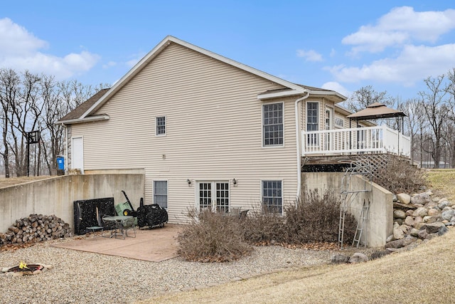 rear view of property with a patio area and a deck