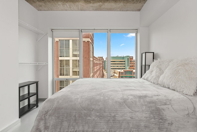 bedroom featuring finished concrete floors