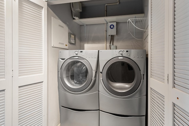 clothes washing area with washer and dryer and laundry area