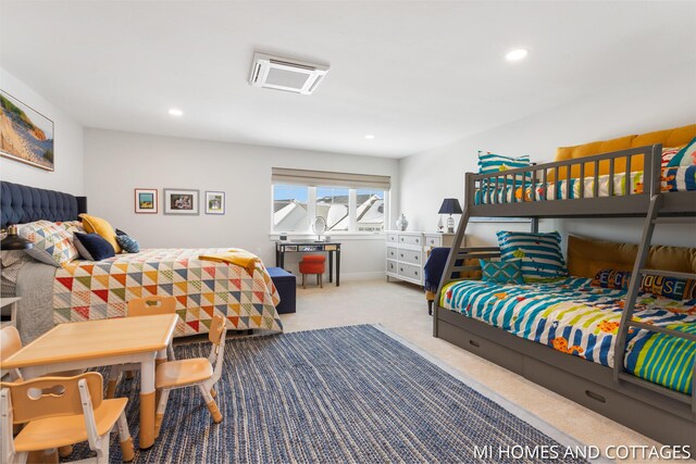 bedroom with recessed lighting and carpet floors