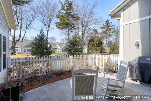 view of patio / terrace featuring area for grilling and fence