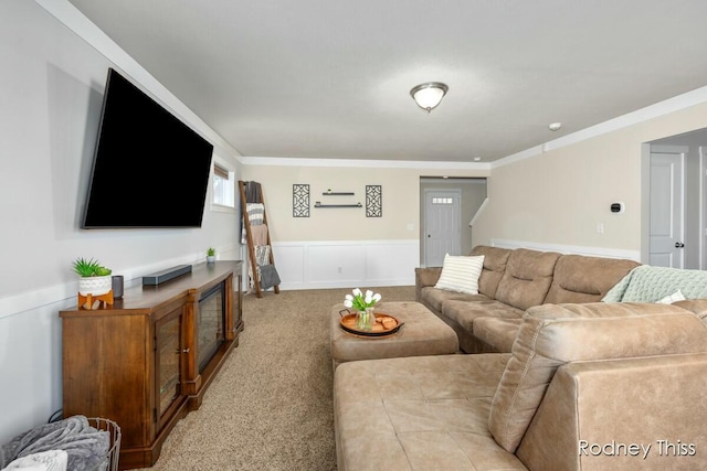 carpeted living area with crown molding