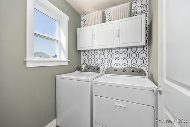 laundry room featuring cabinet space and independent washer and dryer